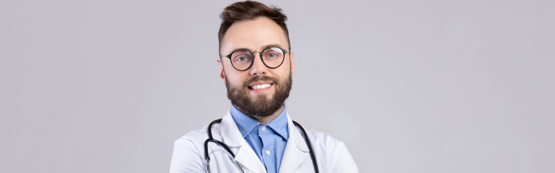 doctor with glasses smiling
